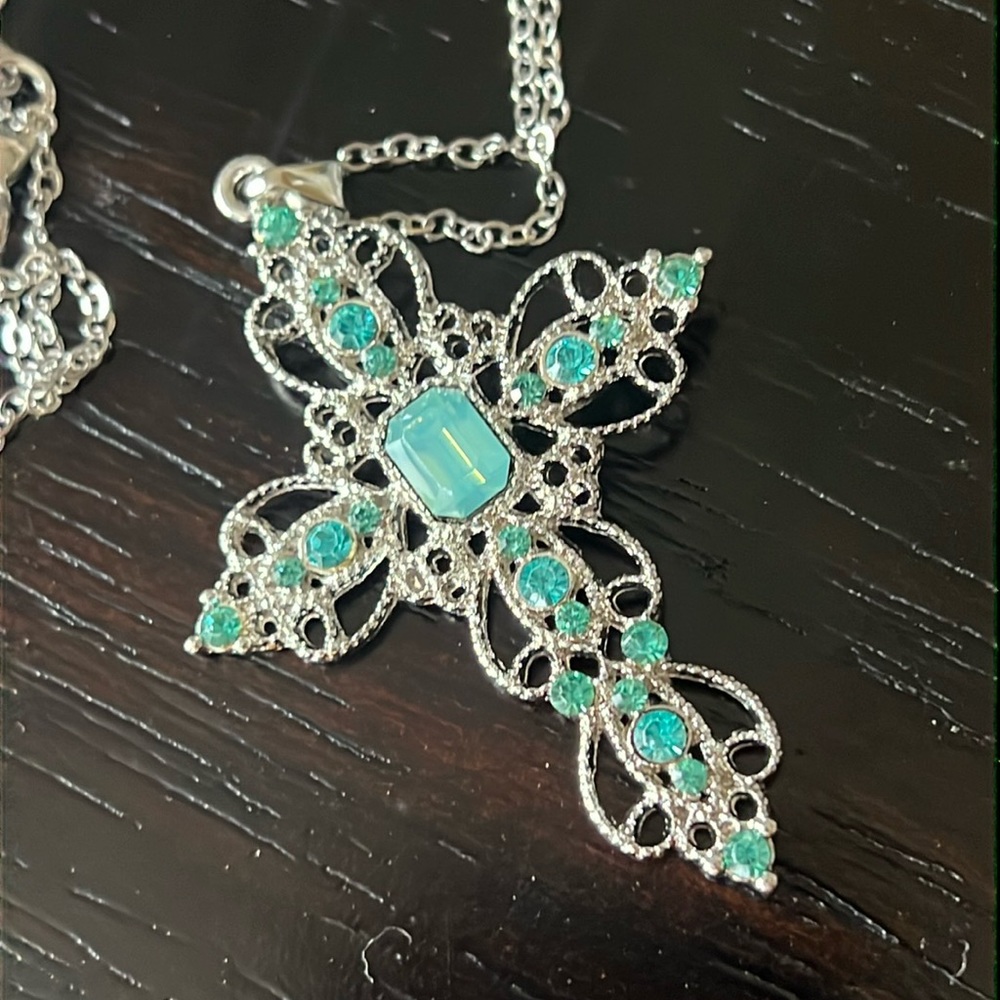 Intricate silver tone and blue stone cross-NWT
